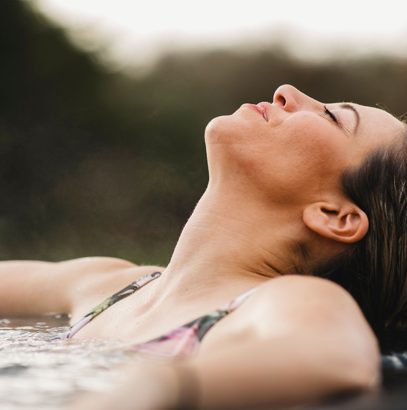 Woman Relaxing In Her Hot Tub Spa